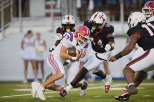 Vestavia Hills' Hudson Mote runs the ball against Thompson’s Walter Larisey during a game at Thompson High School in Alabaster, Ala., Friday, Sept. 4, 2026. (Will McLelland | preps@al.com)Will McLelland
